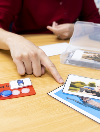 Speech Pathologist pointing to word cards