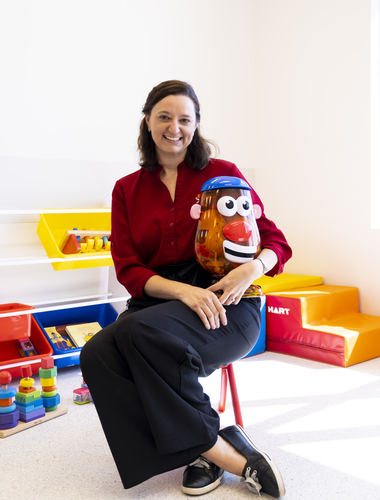 Speech Pathologist holding a Mr. Potato Head