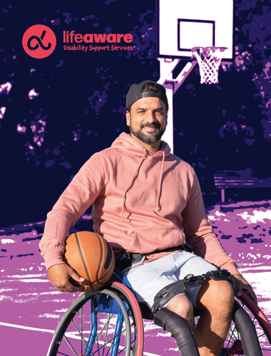 Man in a wheelchair playing basket ball