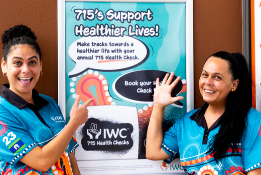 Indigenous Health Workers in front of sign