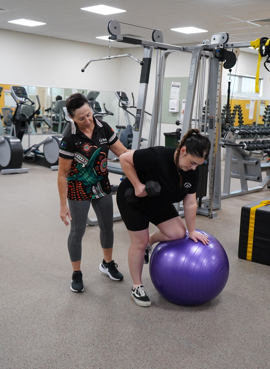 Gay guiding a client in an exercise