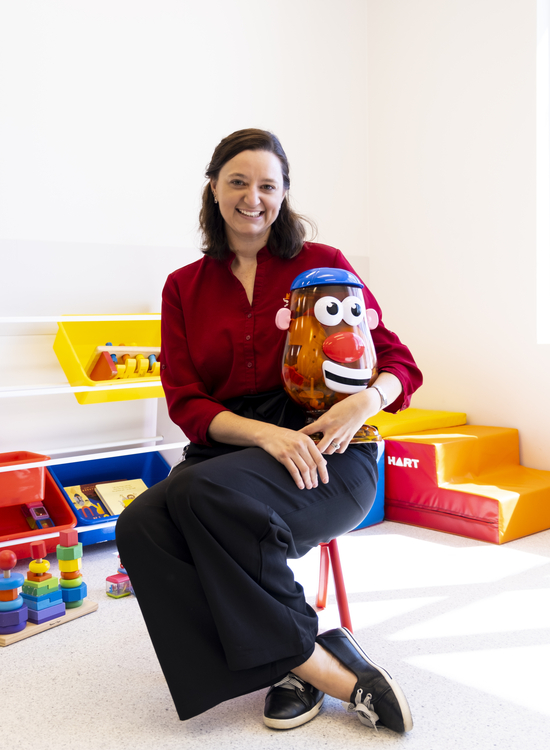 Speech Pathologist holding a Mr. Potato Head