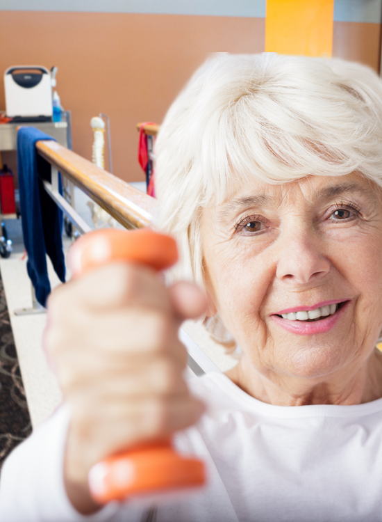 Elderly woman holds a hand weight up