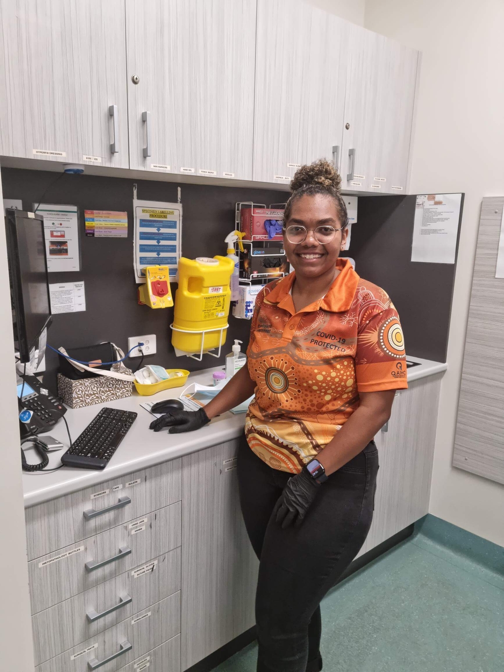 Grace Eggmolesse Stands in IWC Medical Clinic