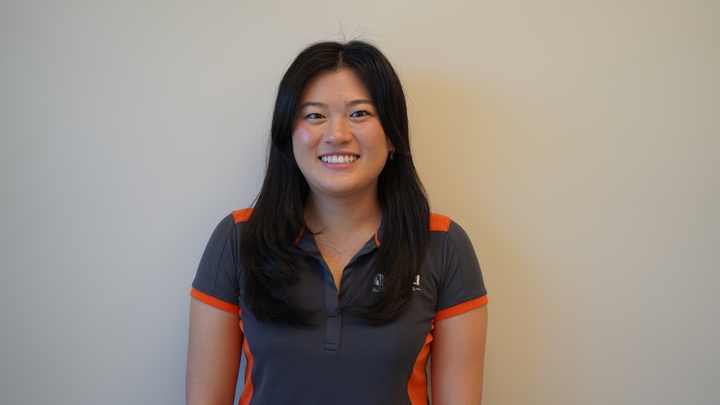 dietitian smiles infront of shelves