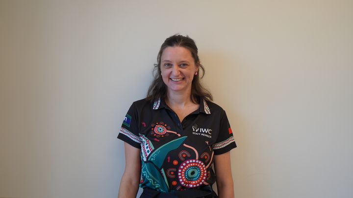 Meg standing in front of a wall