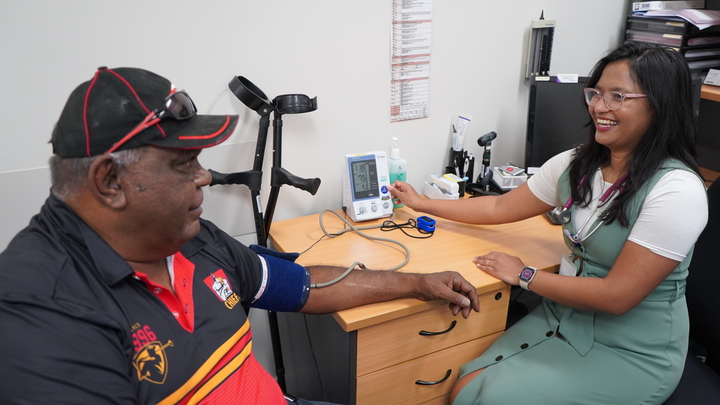 Doctor checking blood pressure