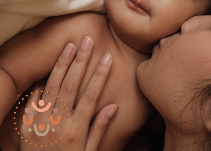 mother kisses her baby