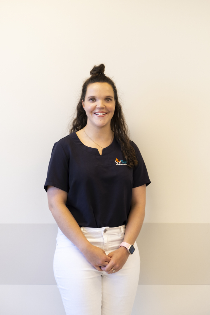 Chloe standing in front of a wall