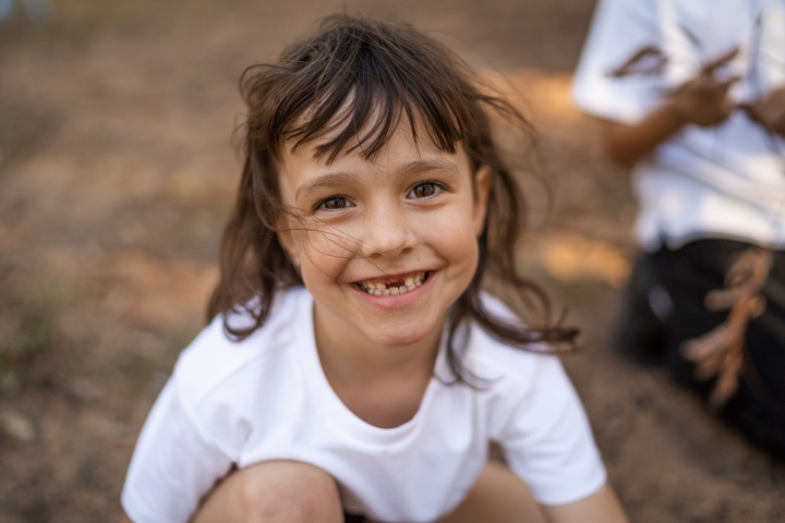 child missing front teeth smiles