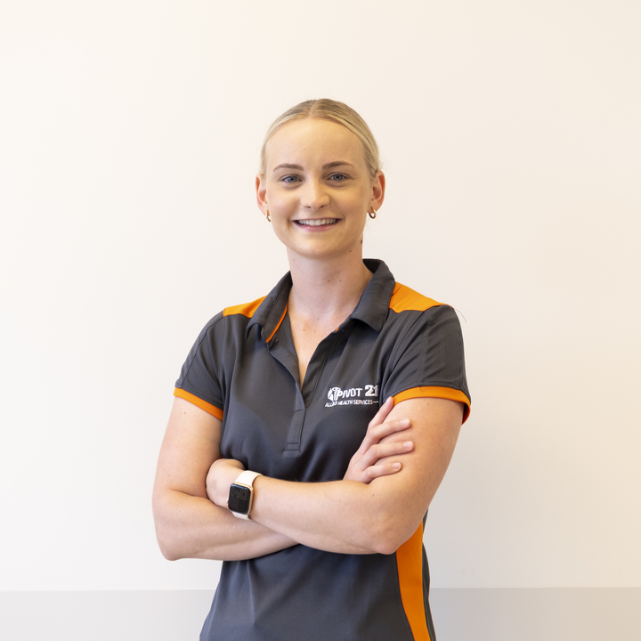 Danielle Wieland looks at camera with arms crossed