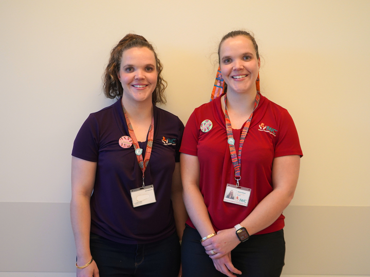 team of dietitians stand in front of food samples