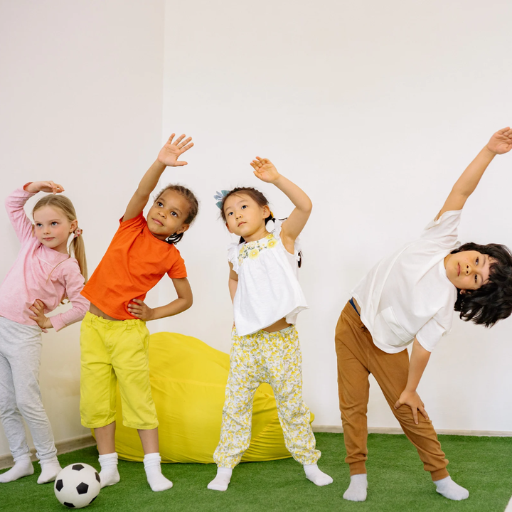 group of 4 children do stretches