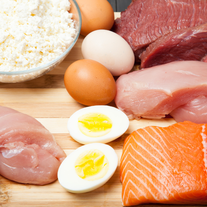 selection of boiled eggs, raw meats and chicken.