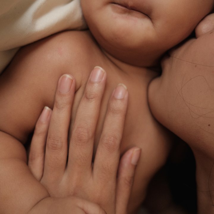 mother kisses her baby
