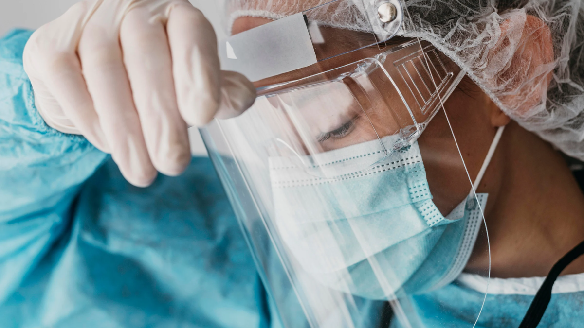 Front line worker wears full PPE