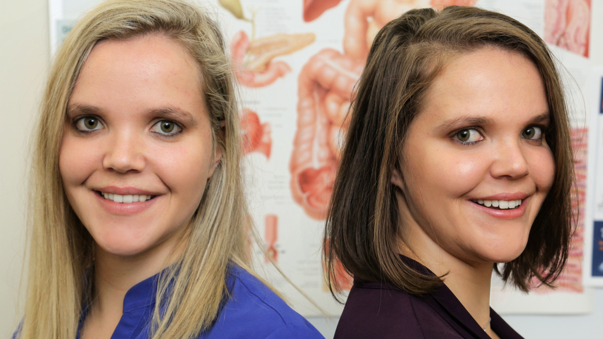 Twin Dietitians Smile at camera