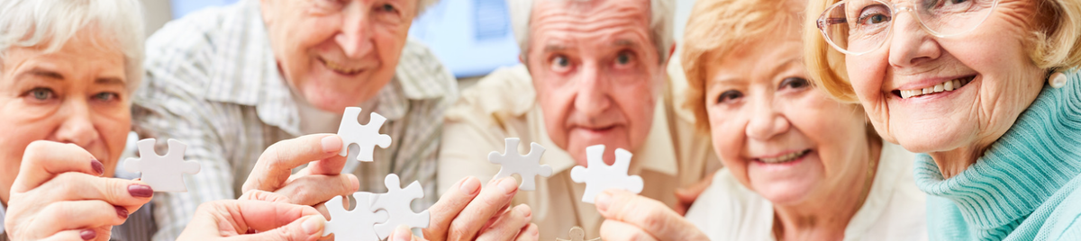 Group of Seniors hold puzzle pieces