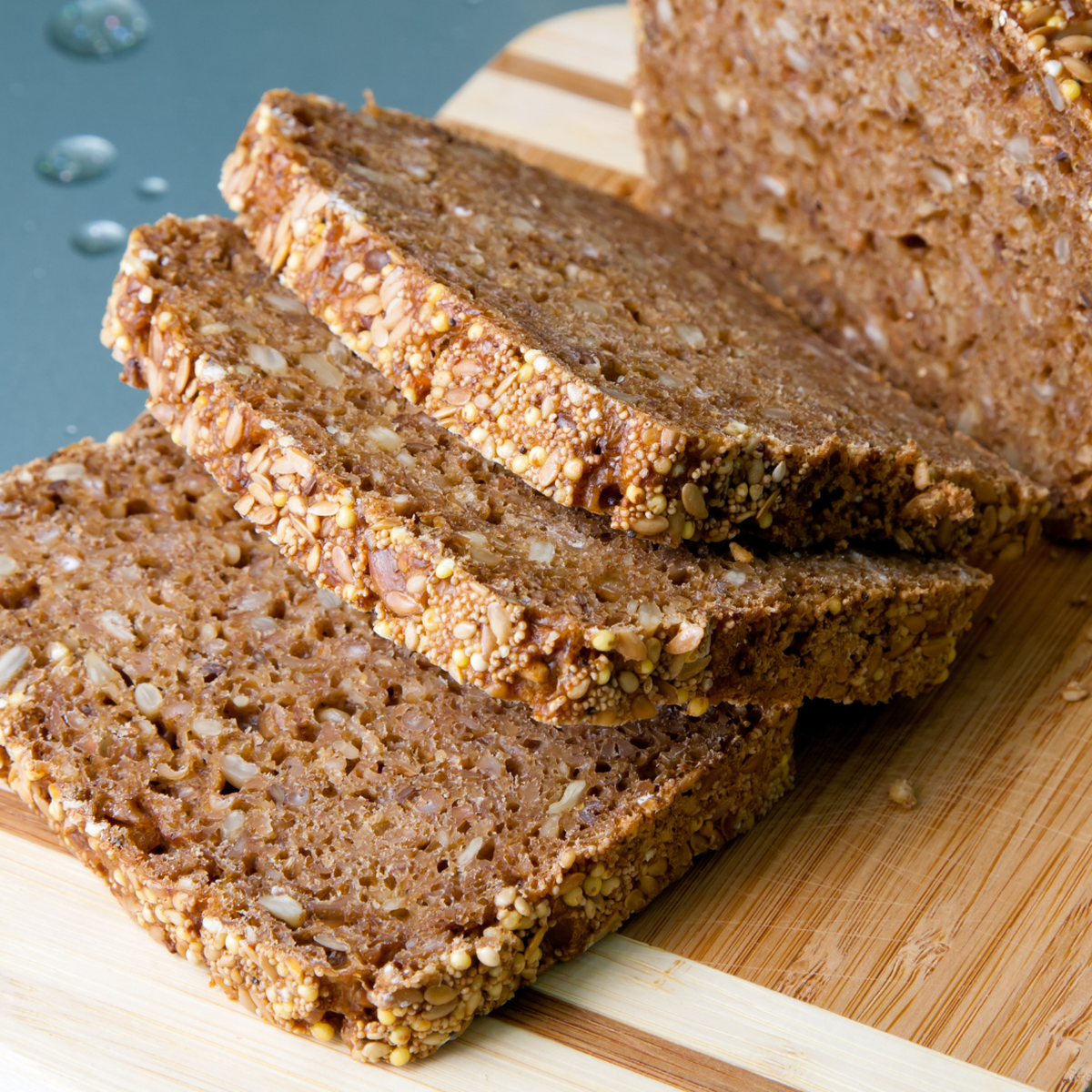 Healthy Grain bread loaf with 3 freshly cut slices