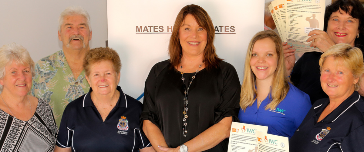 Group stands in front of pull up banner
